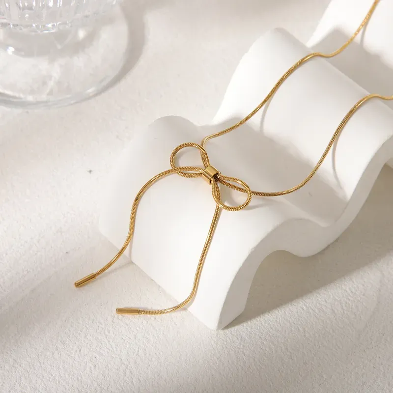Gold Plated Necklace With Long Bow Knot Detail