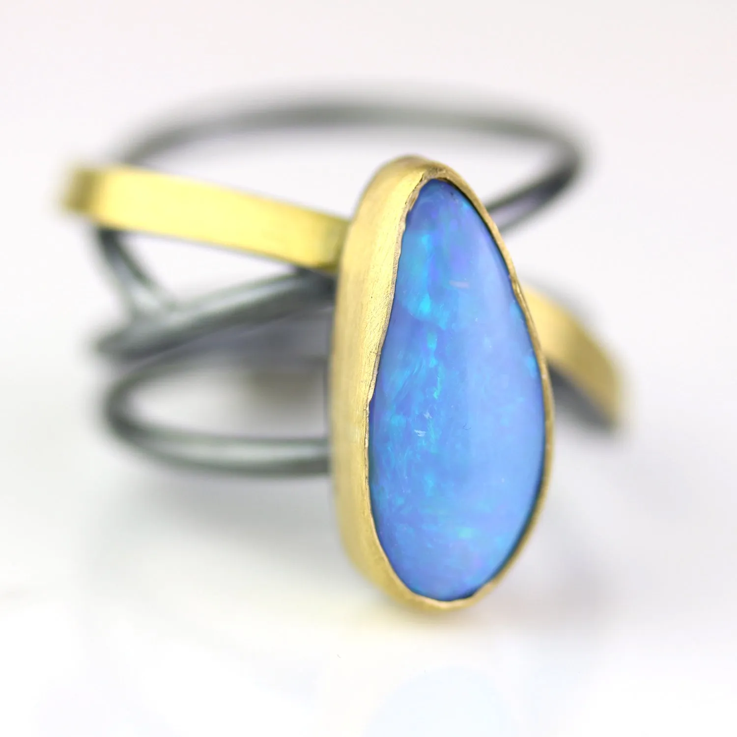 SOLD Azure Blue Opal on a Swirled Band Ring. Size 7 1/2.
