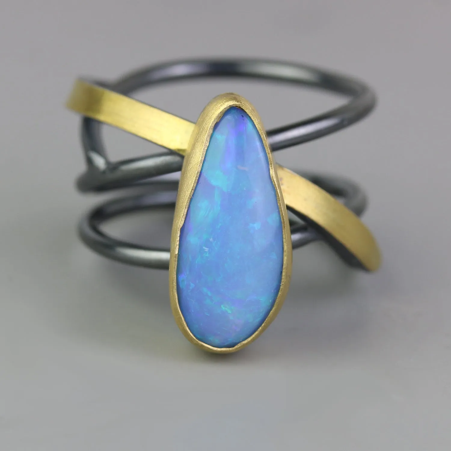 SOLD Azure Blue Opal on a Swirled Band Ring. Size 7 1/2.