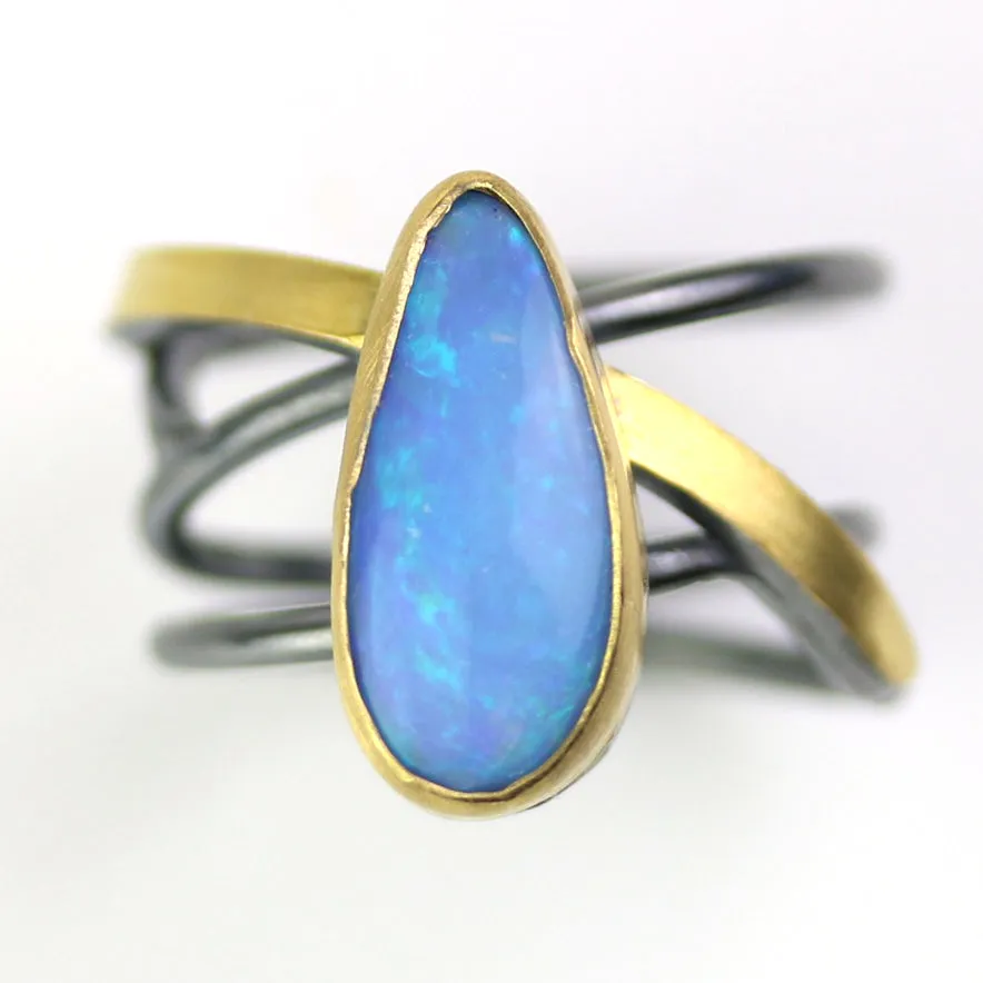 SOLD Azure Blue Opal on a Swirled Band Ring. Size 7 1/2.