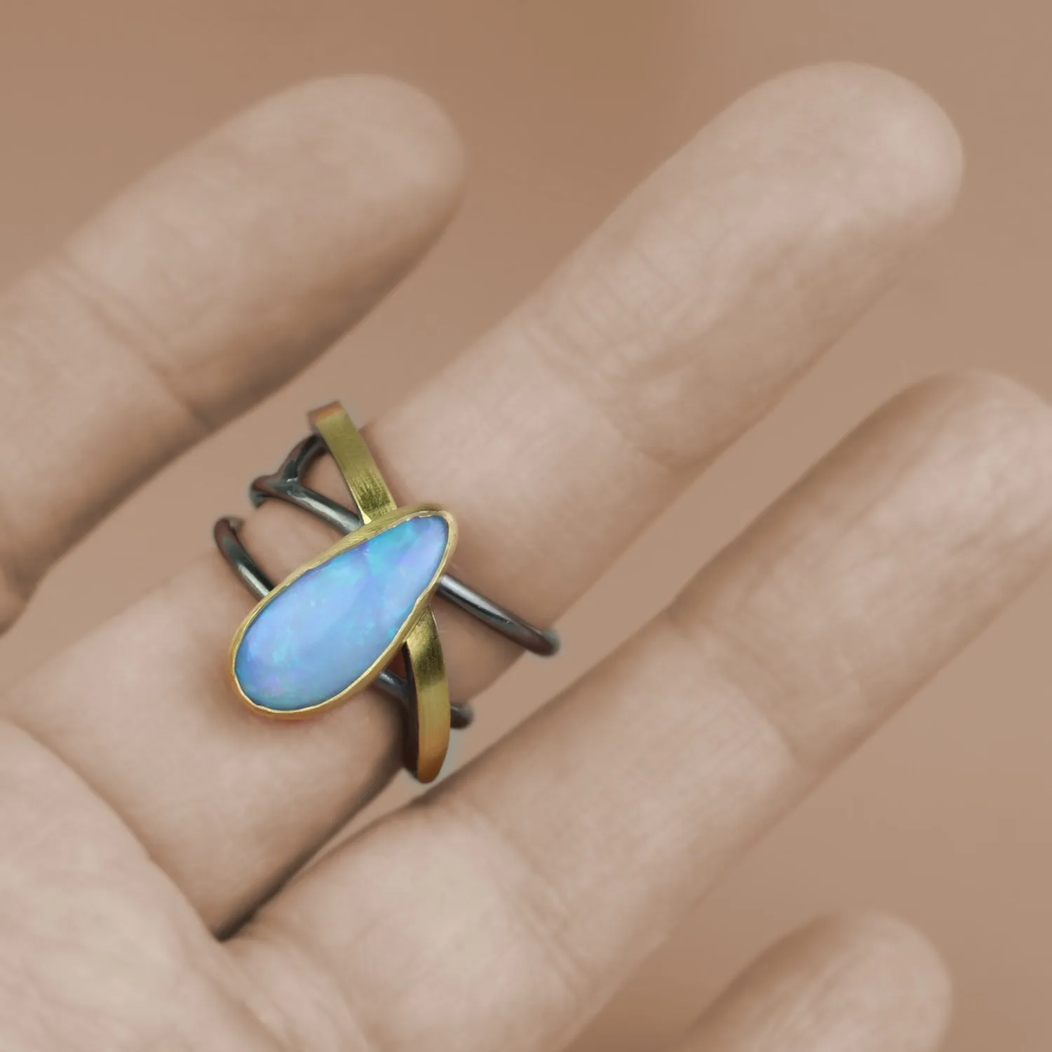 SOLD Azure Blue Opal on a Swirled Band Ring. Size 7 1/2.