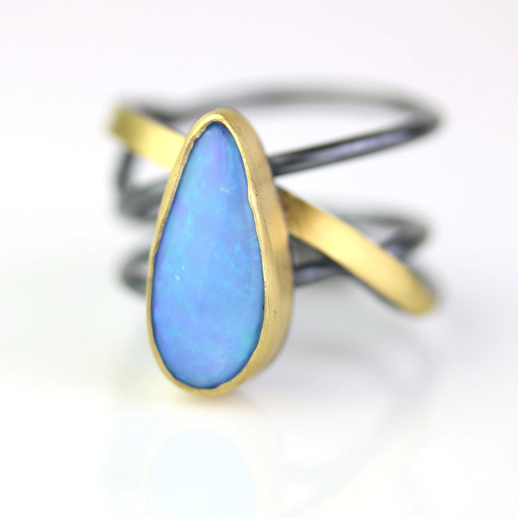 SOLD Azure Blue Opal on a Swirled Band Ring. Size 7 1/2.